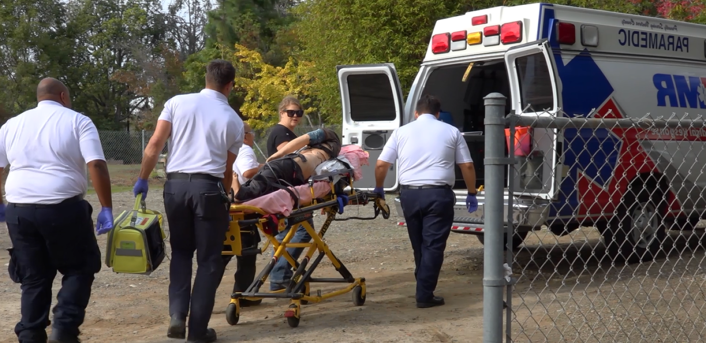 Ventura College Paramedic Students transport patient into ambulance